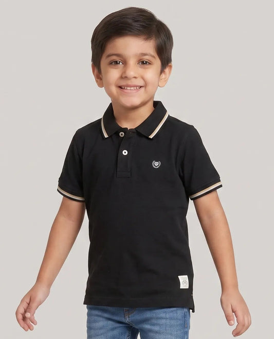 Boys black polo t-shirt close-up of embroidered Kidley crest badge